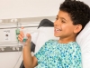 72 Lifestyle Photography Boy Smiling in Hospital Bed