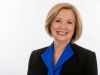 Executive-Business-Woman-Headshot-On-White-Blue-Blouse