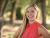 Headshot Outside North Raleigh Studio With Blurred Trees