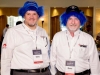 Two-Men-At-Corporate-Conference-Wearing-Blue-Wigs