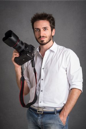 Photographer with Camera In Studio