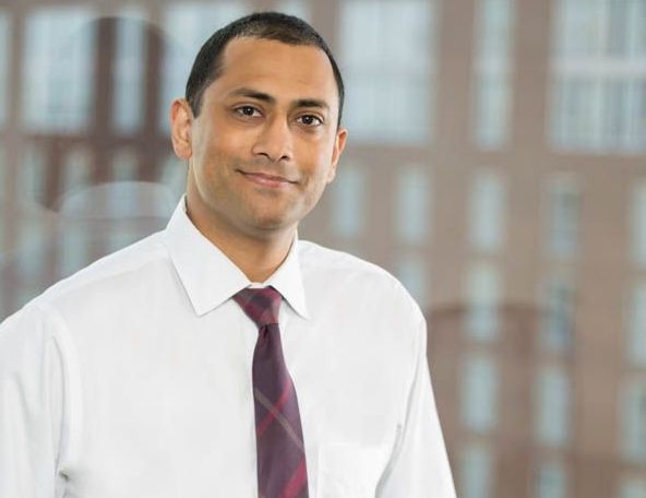 Lawyer Headshot in Downtown Raleigh In Front of Window