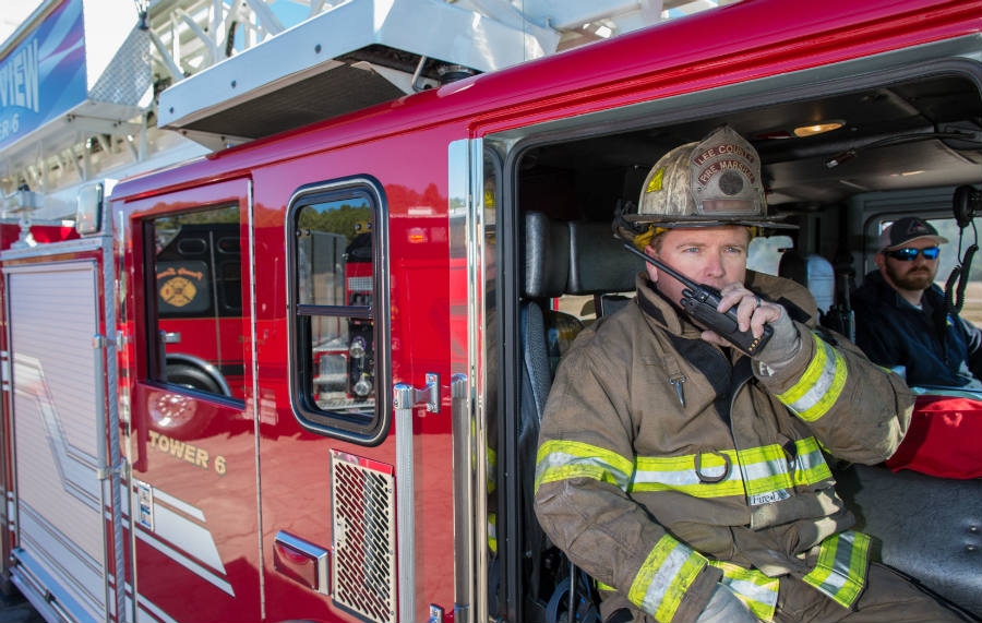 Two Firemen Inside Firetruck One Using Radio Image by DWPPC 2